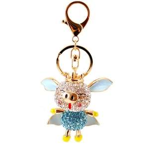 Porte-clés cochon volant étincelant avec strass bleus et fermoir mousqueton doré