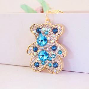 Portachiavi con orsetto di cristallo scintillante con strass blu e bianchi su lega d'oro