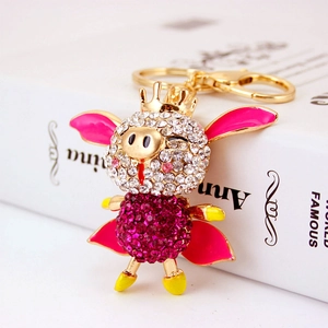 Porte-clés cochon volant scintillant avec strass roses et finition en métal doré