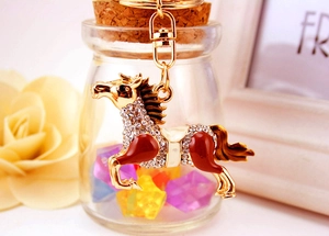 Detailed view of the rhinestone encrusted horse keychain with rich enamel coating