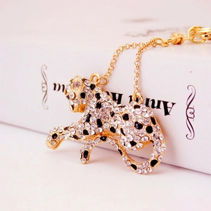 Golden leopard keychain pendant with sparkling crystals and black enamel spots