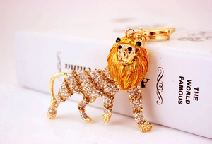 Close-up of golden lion keychain with sparkling rhinestones and lobster clasp
