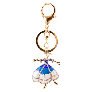 Elegante portachiavi con ballerina dorata e gonna con strass blu e bianchi lucidi