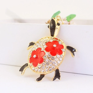 Porte-clés tortue dorée avec strass et fleurs en émail rouge pour décoration de sac