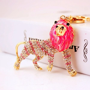 Cute lion keychain with pink crystal rhinestones and golden metal finish for handbags