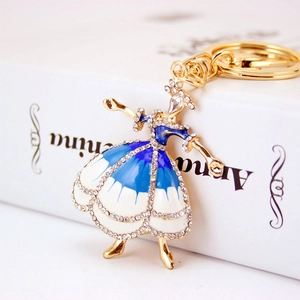 Portachiavi ballerina con smalto blu e strass luminosi su base in metallo dorato
