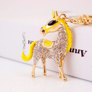 Sparkly crystal horse keychain with yellow enamel accents and gold metal lobster clasp
