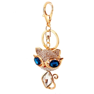 Portachiavi gattino con strass scintillanti e occhi in cristallo blu su metallo dorato