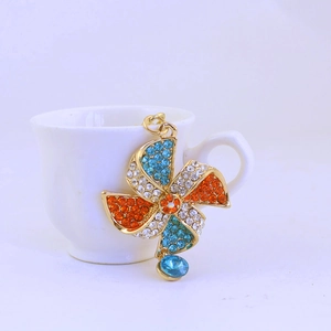 Fashionable crystal windmill keychain in gold alloy with blue and orange rhinestones