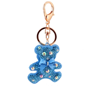 Sparkling sky blue crystal bear keychain with rhinestone bow and rose gold metal clasp