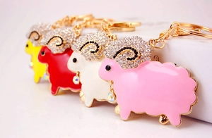Detail view of colorful sheep keychains with crystal charms and rhinestone embellishments