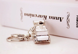 Creative silver train locomotive keychain with white enamel and crystal detail