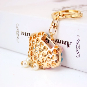 Porte-clés perle serrure de longévité en œil de chat avec pendentif en métal doré en forme de cœur