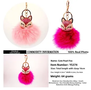 Detail view of fox pendant keychain with rhinestones and soft fur pom pom showing dimensions
