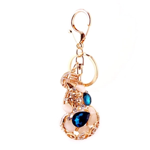 Golden hollow gourd keychain with blue rhinestones and opal stone for women's bags