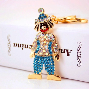 Portachiavi clown creativo con cristalli colorati e placcatura oro su libro