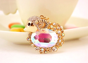 Macro shot of a crystal goat keychain with gold plating and sparkling AB rhinestones