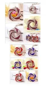 Detail of circular swivel keychains with colorful rhinestones in purple, red, and blue