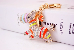 Detail of creative zebra keychain with sparkling crystals and colorful enamel stripes