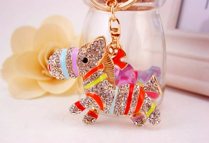Detail of creative donkey keychain with gold plating, sparkling rhinestones and colorful enamel