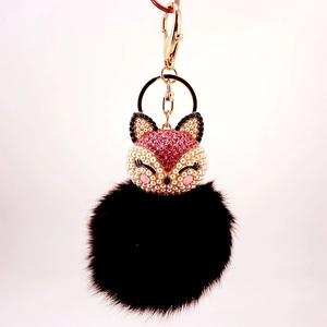 Creative crystal fox head keychain with fluffy black fur ball and gold metal clasp