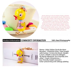 Detail view of a sparkling yellow duck keychain with crystal rhinestones and enamel finish