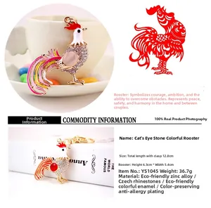 Close-up of rooster keychain with Czech rhinestones, cat eye stone, and zinc alloy detail