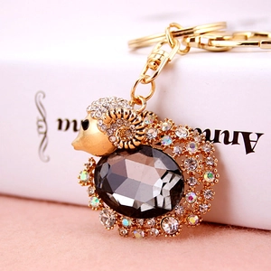 Exquisite crystal sheep keychain featuring grey gemstone and sparkling diamond accents