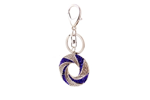 Close-up of twisted ring keychain with blue and white crystals on silver metal hardware