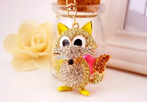 Detailed close-up of crystal fox keychain with gold metal base and sparkling rhinestones