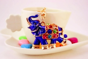 Close-up of blue enamel elephant keychain with multicolored rhinestones and gold lobster clasp