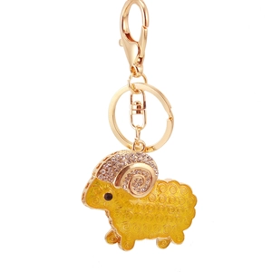 Cute gold plated sheep keychain with sparkling white rhinestones and yellow enamel inlay