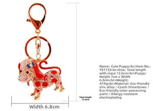 Détail du porte-clés chiot mignon avec dimensions 7x6,8cm et fermoir mousqueton