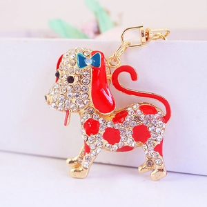 Cartoon dalmatian dog keychain with sparkling rhinestones and blue bow decoration