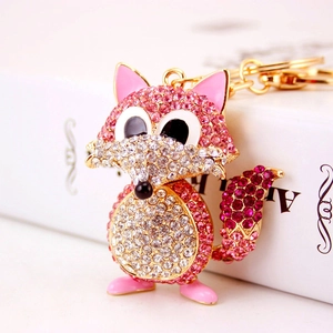 Sparkling fox keychain with pink and white crystals on a premium gold metal base