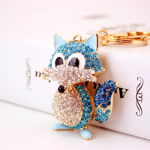 Sparkling blue crystal fox keychain in gold-plated alloy with detailed rhinestone accents
