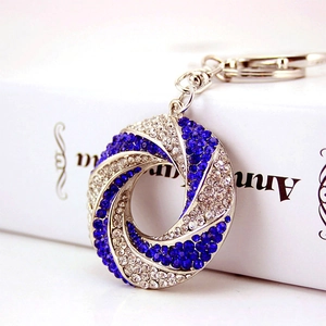Sparkling crystal encrusted swirl keychain in royal blue and silver for women