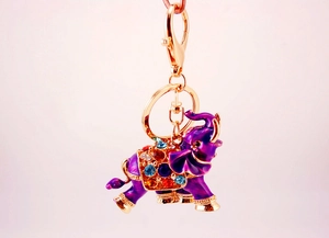 Detailed close-up of elephant keychain with purple enamel and colorful rhinestones