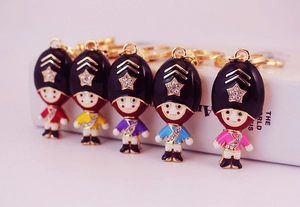 Detailed view of five colorful royal guard keychains with sparkling crystal stars