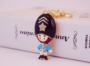 Detailed close-up of Royal Guard keychain with blue uniform and sparkling crystals