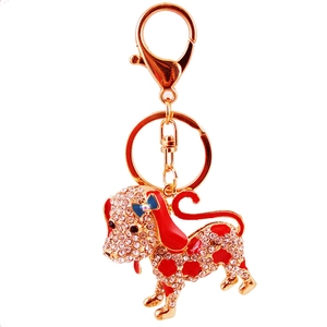 Cute Dalmatian dog keychain with sparkling rhinestones and red enamel details on gold base