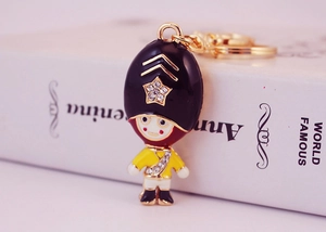 Detailed view of Royal Guard crystal keychain with enamel finish and gold ring