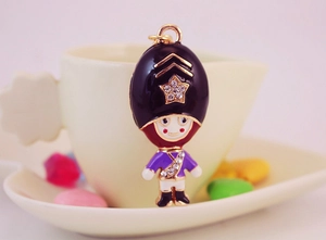 Detail of Royal Guard keychain with sparkling crystals and colorful enamel plating
