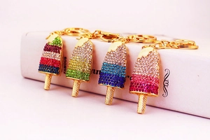 Macro view of colorful crystal rhinestone ice cream keychains in four vibrant summer patterns