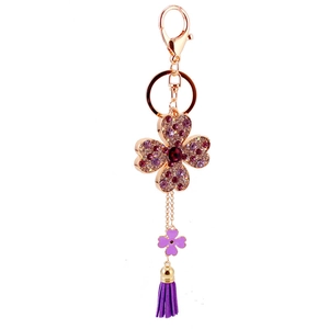 Portachiavi quadrifoglio con strass brillanti, nappe viola e finitura dorata