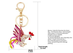 Detail of colorful rhinestone rooster keychain with pink crystals and enamel finish