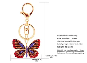 Detailed view of colorful butterfly keychain with rhinestones and golden lobster clasp