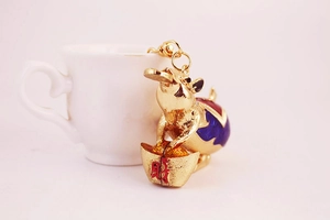 Detailed view of golden zodiac rat keychain with colorful enamel and lucky coin charms