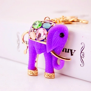 Purple resin elephant keychain with colorful gemstones and exotic gold metal patterns