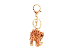 Detailed close-up of golden elephant keychain with sparkling champagne rhinestones